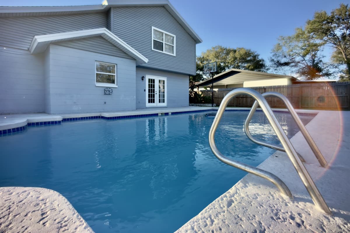 Whether you're floating in the crystal-clear pool or stretching out on a lounge chair, this backyard is designed for ultimate relaxation.