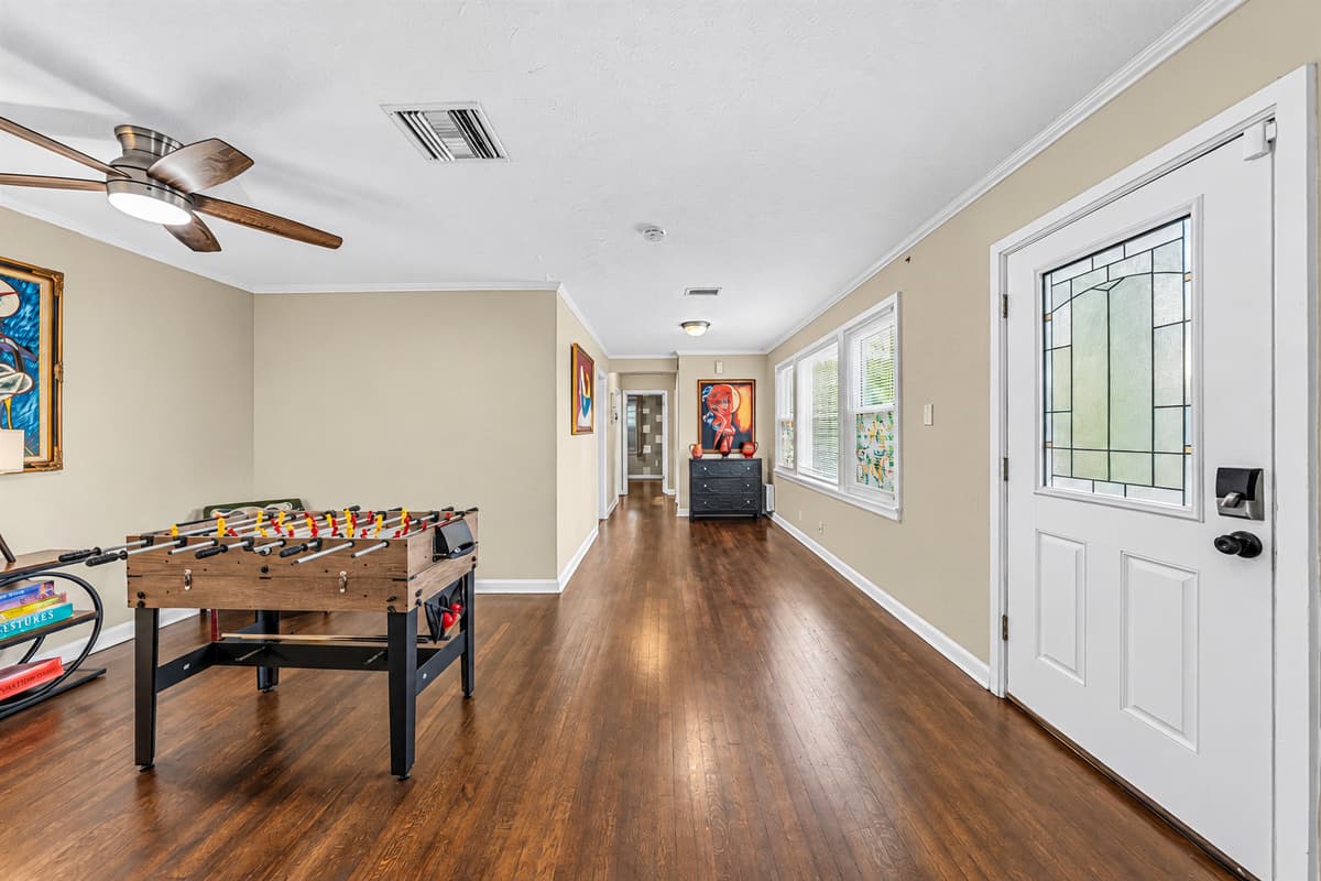 Long entertainment space with foosball table and plenty of room to relax or play.