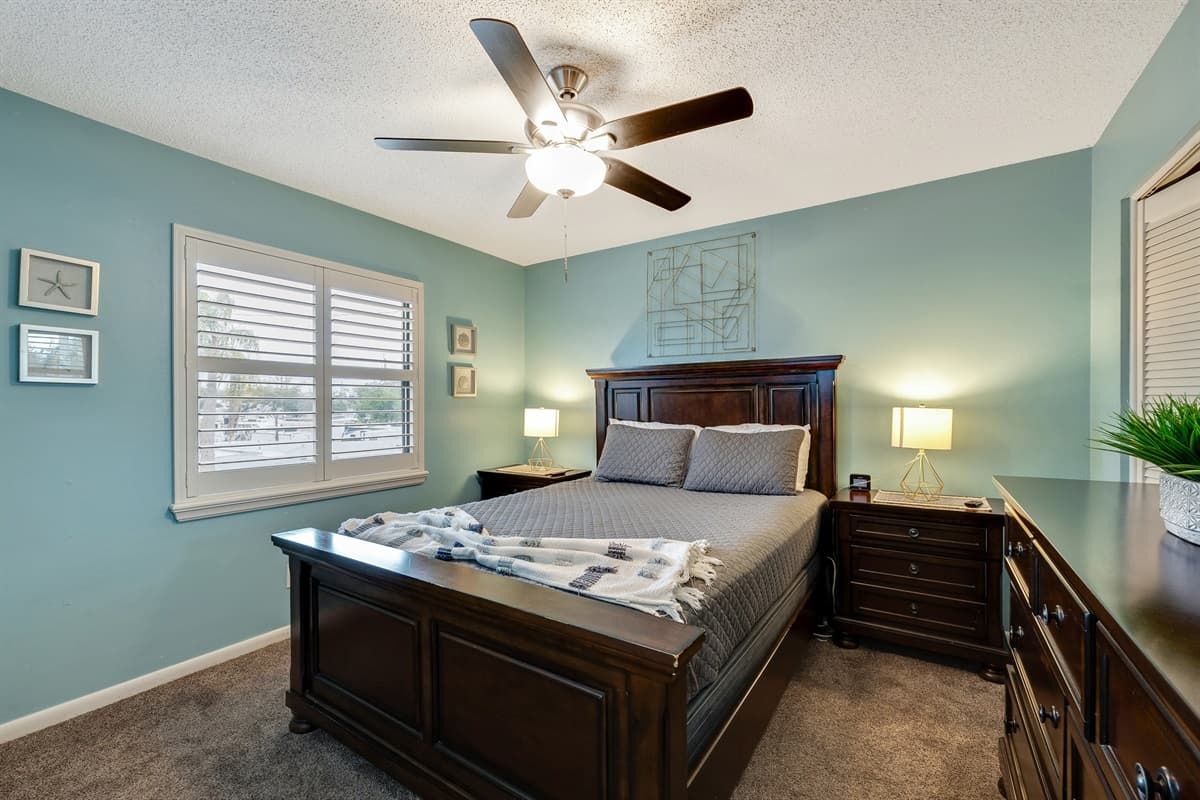 Indulge in a cozy and rejuvenating experience as you rest upon the queen size bed, adorned with soft, luxurious linens and an abundance of plush pillows.