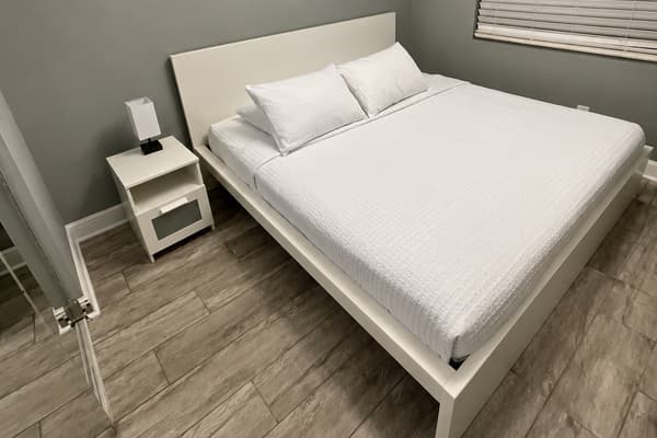 Features a spacious king-size bed and a clean, modern design. Soft lighting, neutral tones, and simple décor create a cozy and relaxing atmosphere. *Updated photos will be uploaded soon!