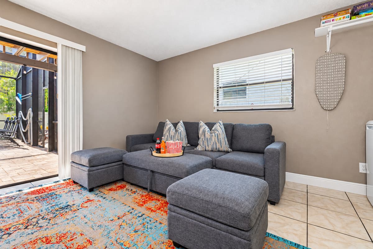This spacious lounge-style living room is designed with comfort, color, and entertainment in mind.