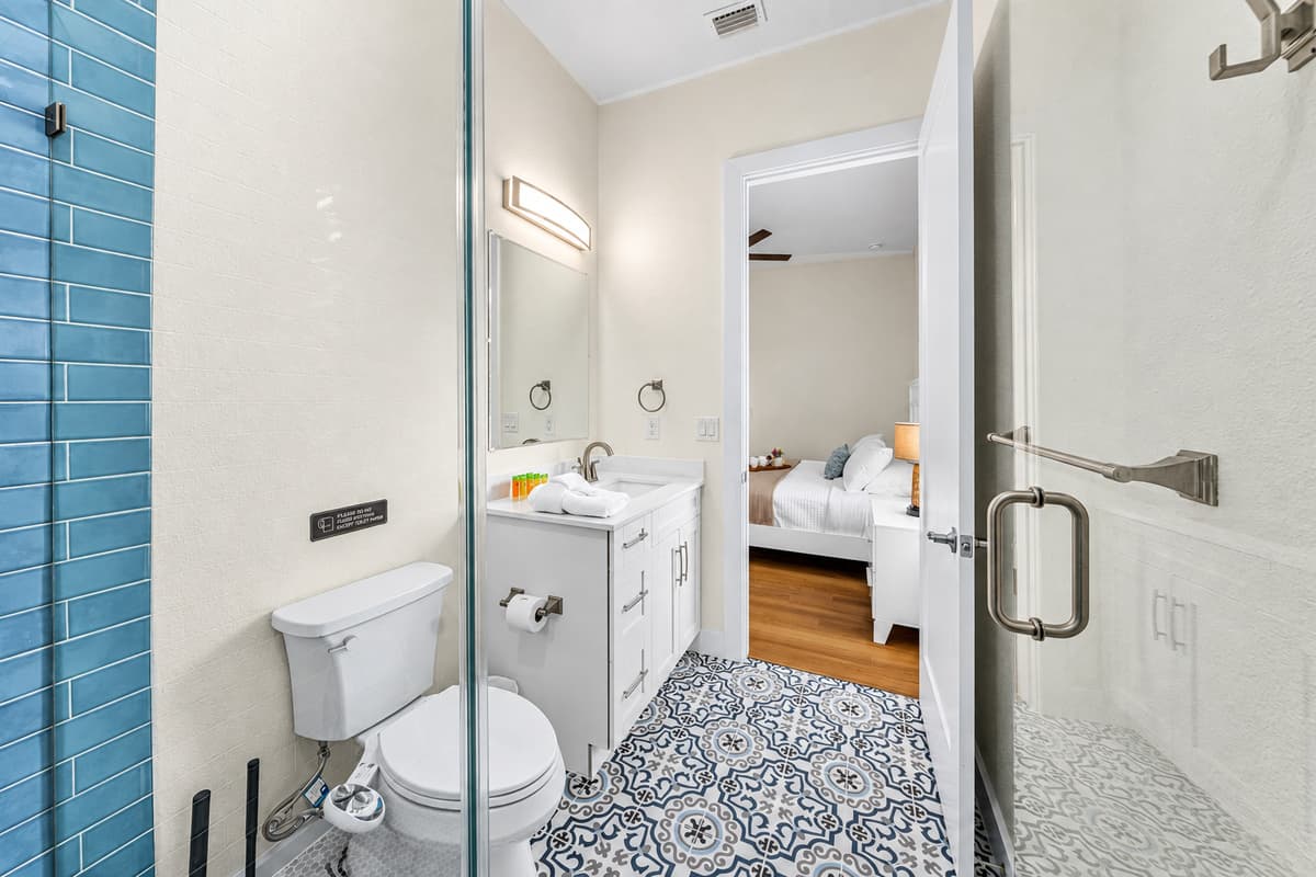 Stylish bathroom featuring glass shower and contemporary finishes.