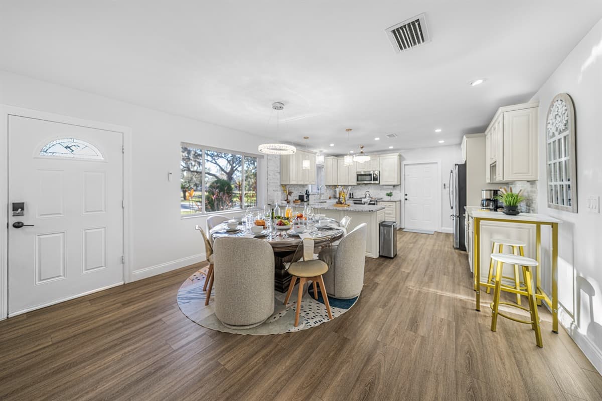 With its elegant lighting and comfortable seating, the dining area is perfect for entertaining or family meals.