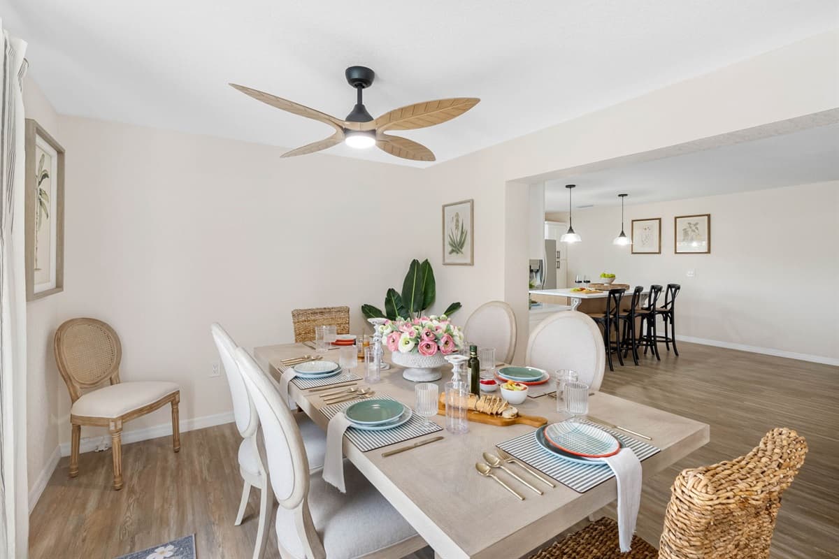 With its soft neutral tones, stylish lighting, and comfortable seating, this dining space strikes the perfect balance between cozy and refined.