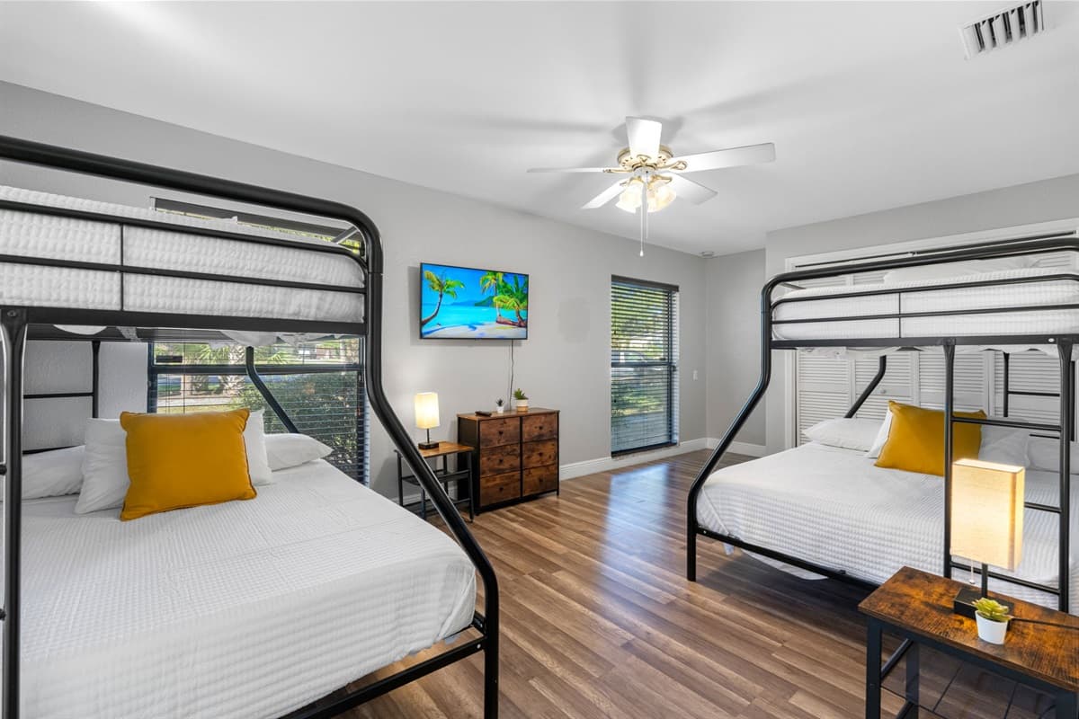 Ideal for families or groups, this roomy setup features two twin-over-full bunk beds for ultimate comfort.
