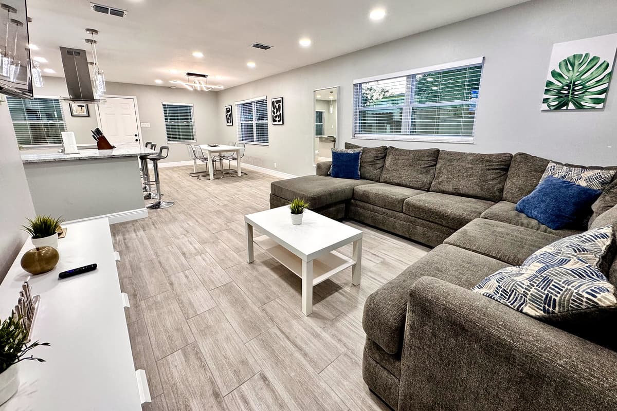 The open floor plan of the home creates a seamless connection between the living area, dining space, and kitchen.