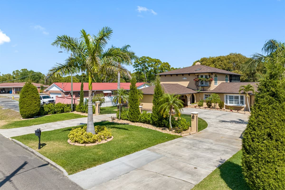 Step onto the impressive front porch and take in the magnificent view of the neighborhood, complete with towering trees and picturesque sidewalks.