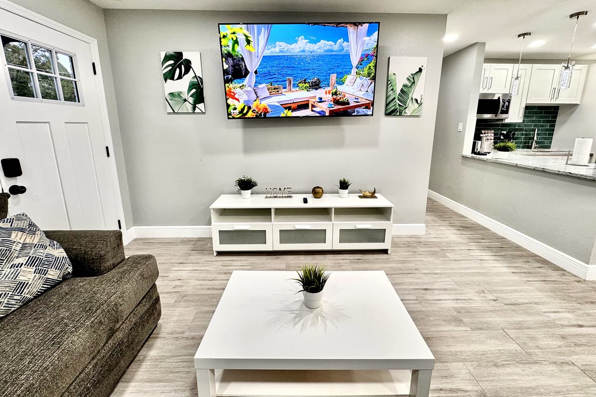 A large smart TV takes center stage, mounted on the wall or perched on a stylish entertainment console.