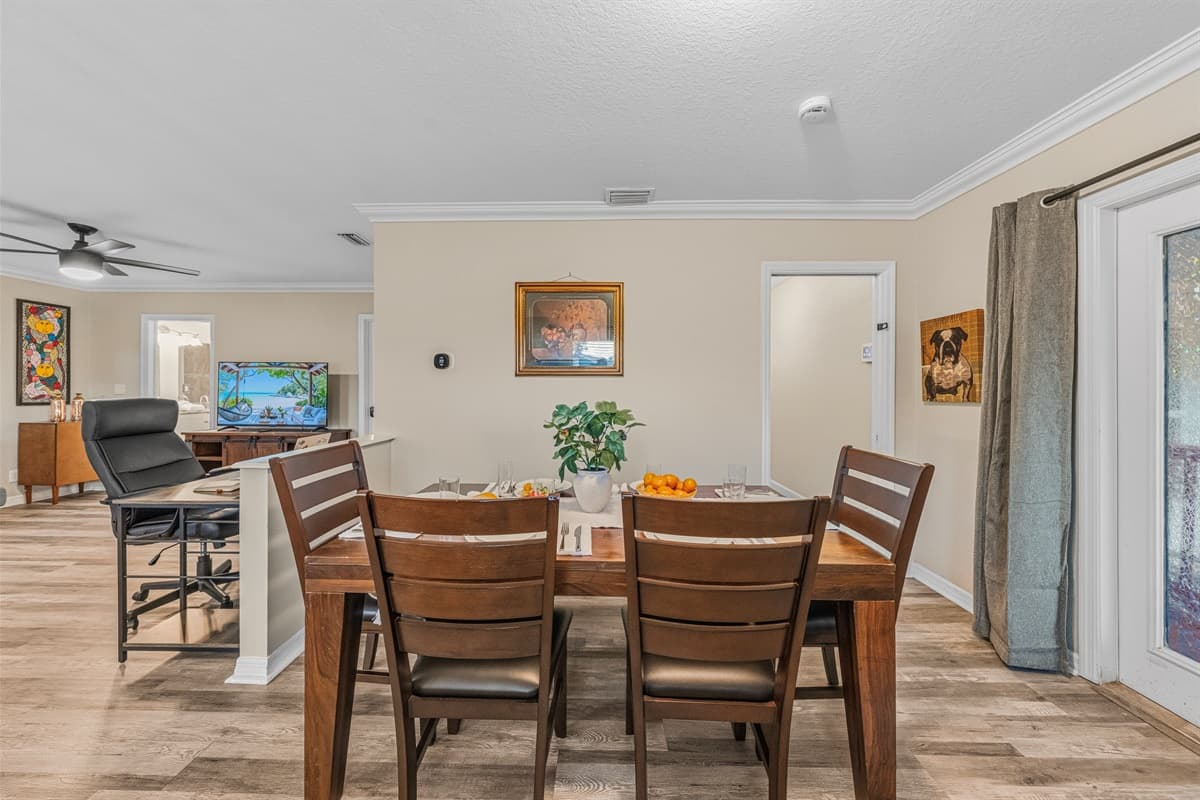 Open dining space flowing into the living room, creating a warm and social atmosphere.