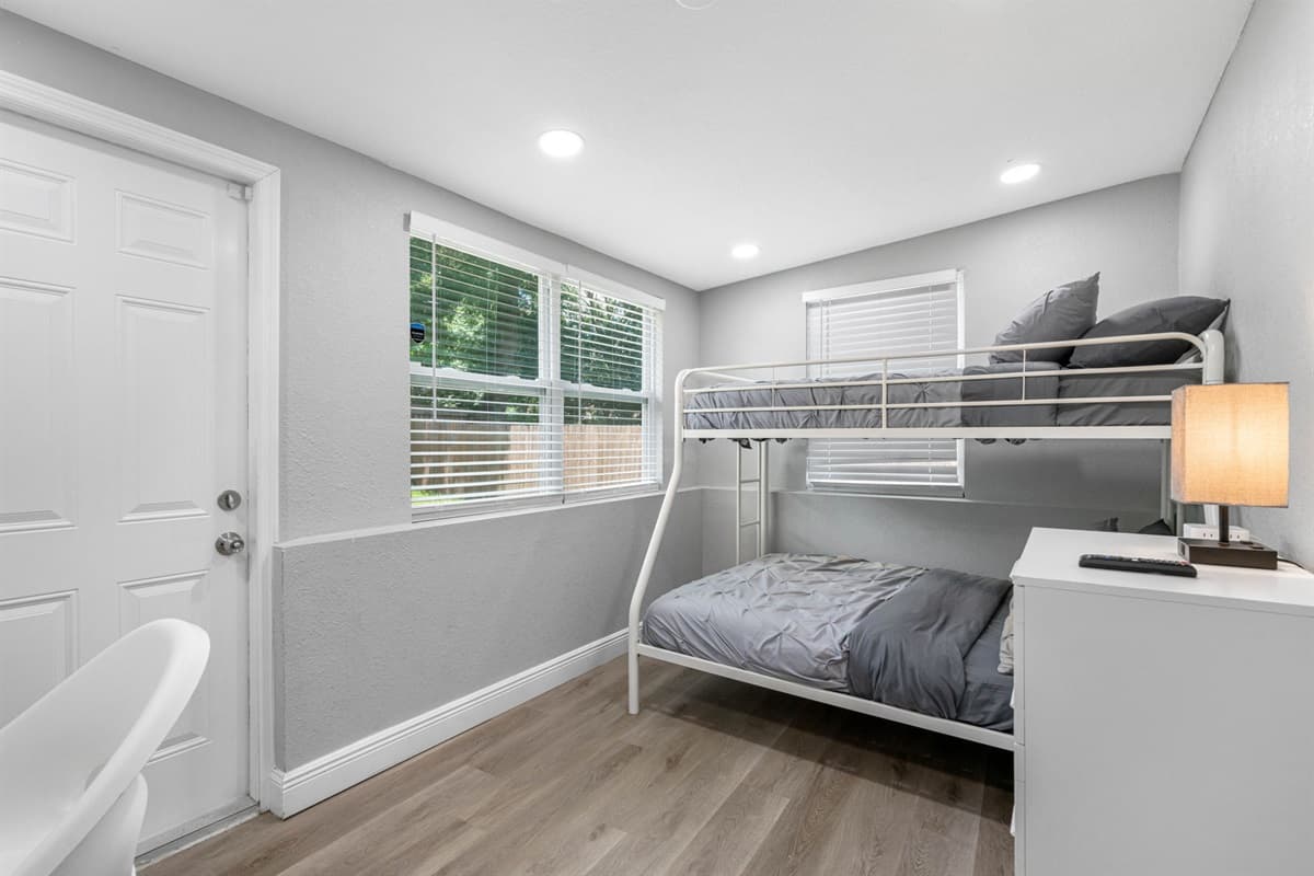 This delightful bedroom features a charming bunk bed, perfect for fun-filled nights and fostering a sense of adventure.