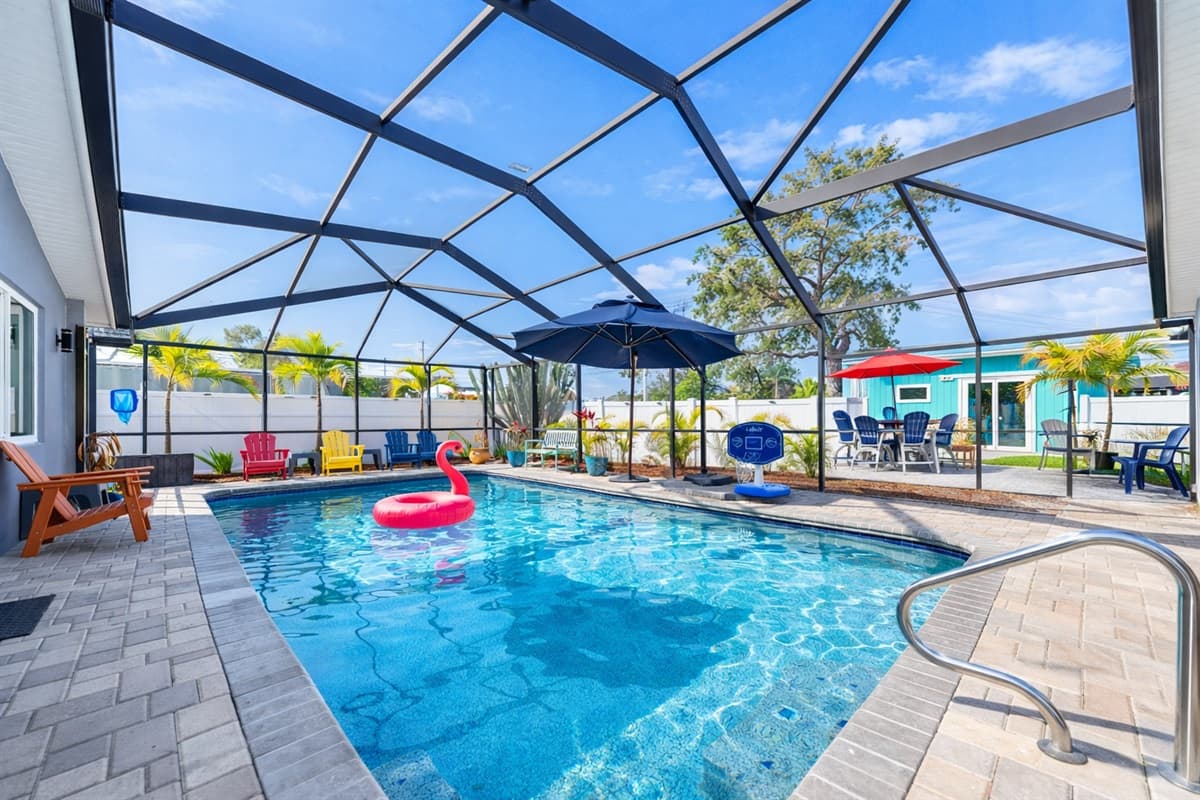 Bright and inviting screened-in pool area perfect for relaxing under the Florida sun.