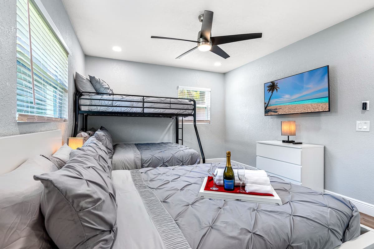 Bunkbed and a double size bed for a small family or a group of friends who wants to hang out and sleep in one room. It is very spacious and has its own smart TV. 