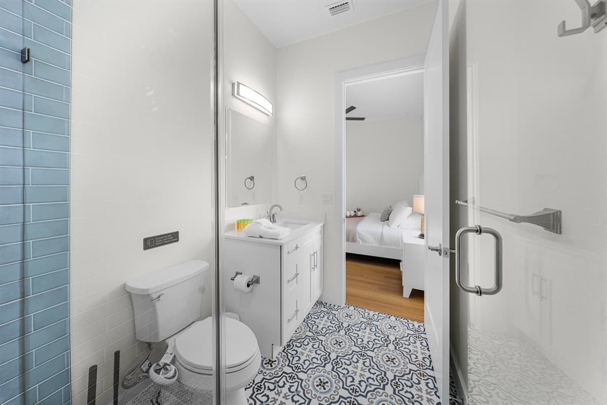 Stylish bathroom featuring glass shower and contemporary finishes.