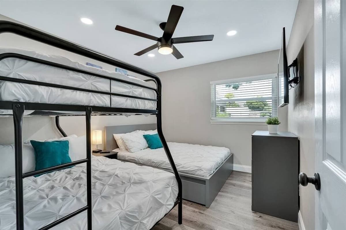This bedroom is perfect for a small family or a group of friends who wants to hang out and sleep in one room. It is very spacious and has drawers for storage. If you are interested to book this house, Send us a message now!