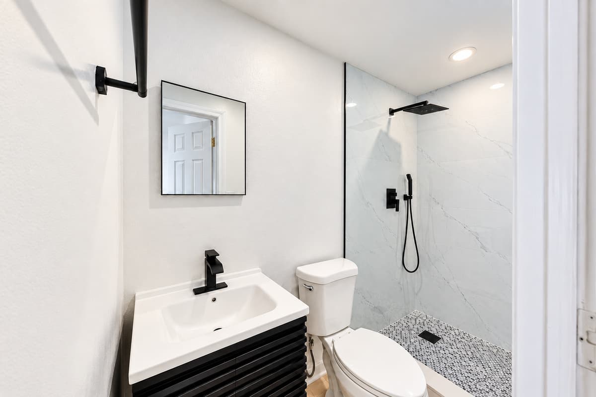 STUDIO UNIT
Private studio suite bathroom featuring a modern walk-in shower and updated fixtures for added comfort and convenience.