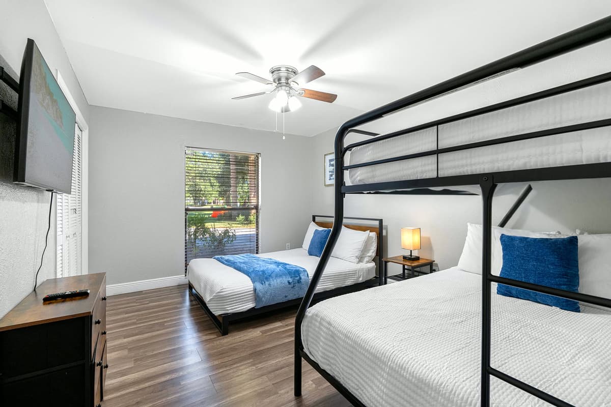 Sunlight fills this cheerful bedroom — designed for comfort and convenience for all ages.