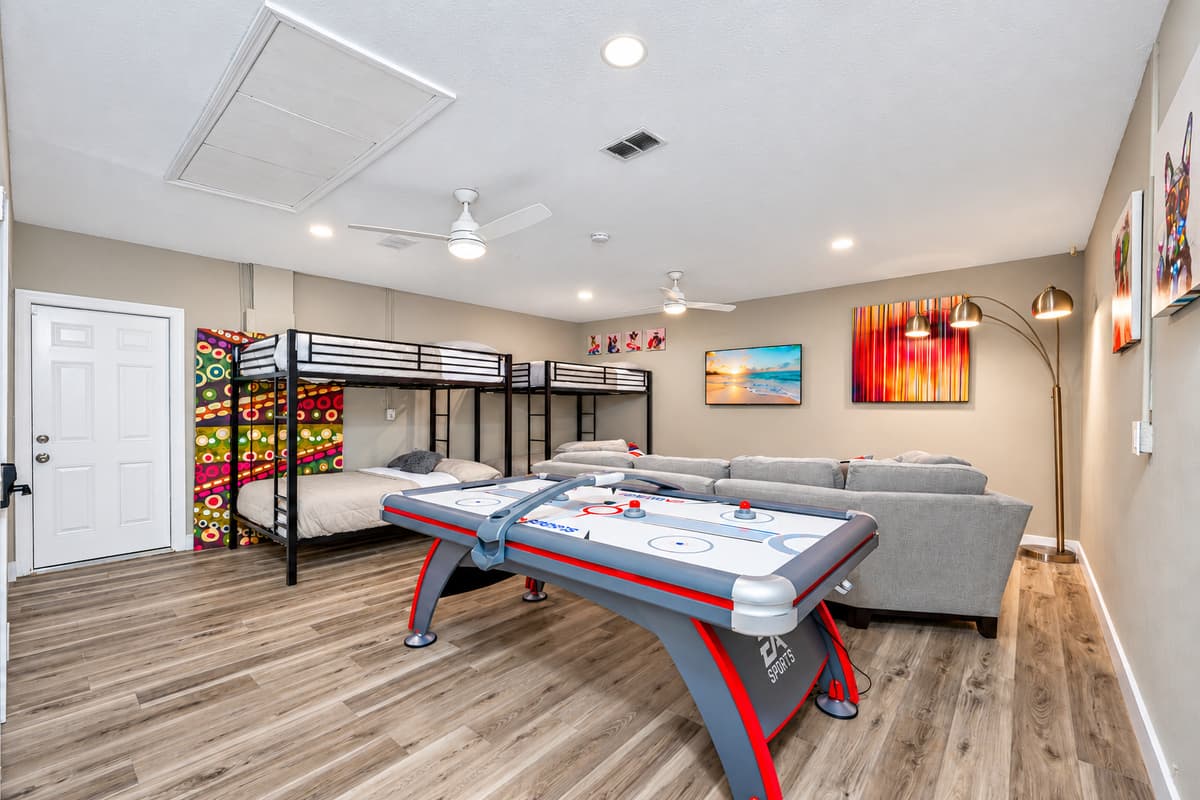 This lovely bedroom has enough sleeping space for kids and let them have their own space to watch movies they like and play games too.