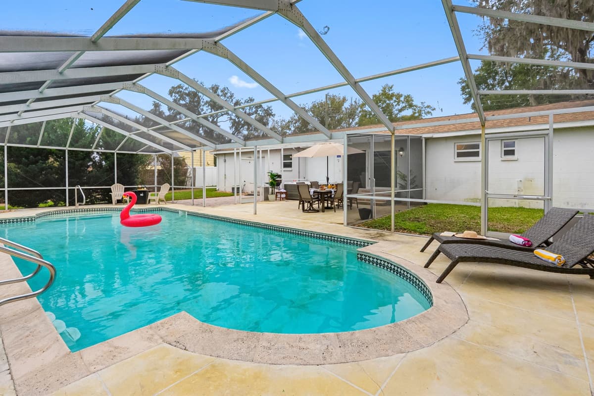 Relax in this private screened-in pool, perfect for sunny Florida days and peaceful evenings.