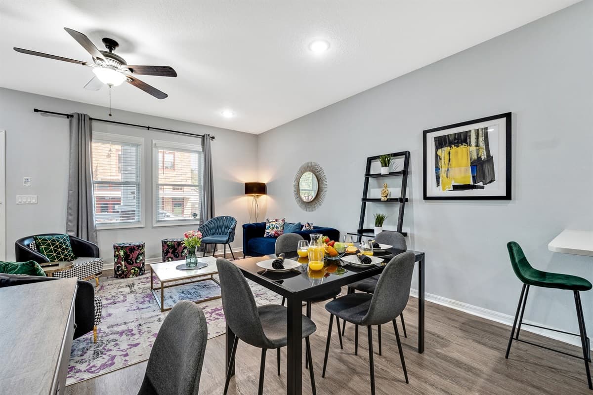 The focal point of the dining area is an exquisite 4-seater table, a piece of furniture that exudes elegance and complements the overall aesthetic of the room.