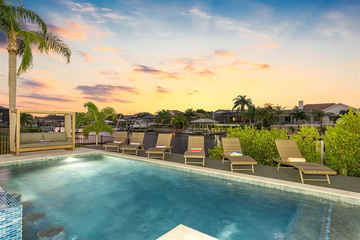 Plush lounge chairs line the poolside, inviting you to soak up the sun or unwind with a good book.