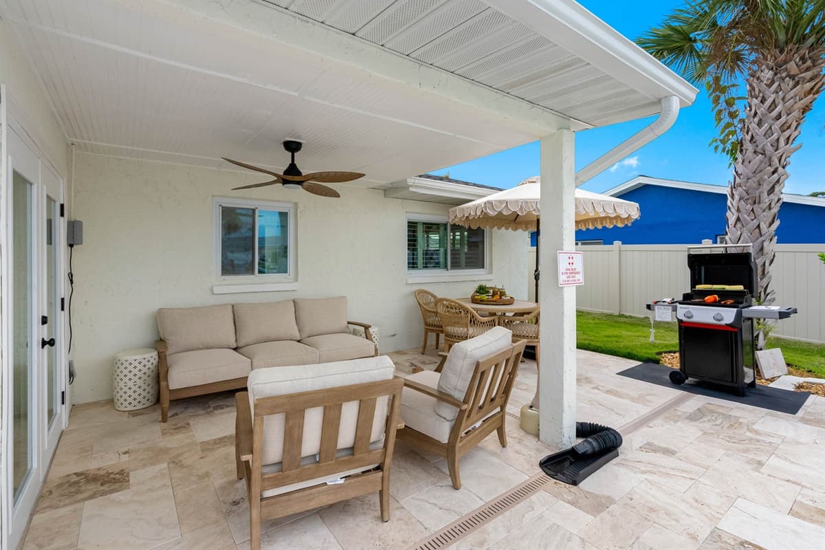 Comfy lounge chairs and a sofa make this the ultimate spot to unwind outdoors.