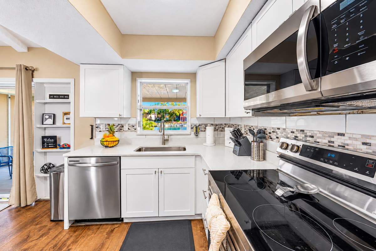 Modern kitchen layout with premium appliances and an open flow into the dining area.