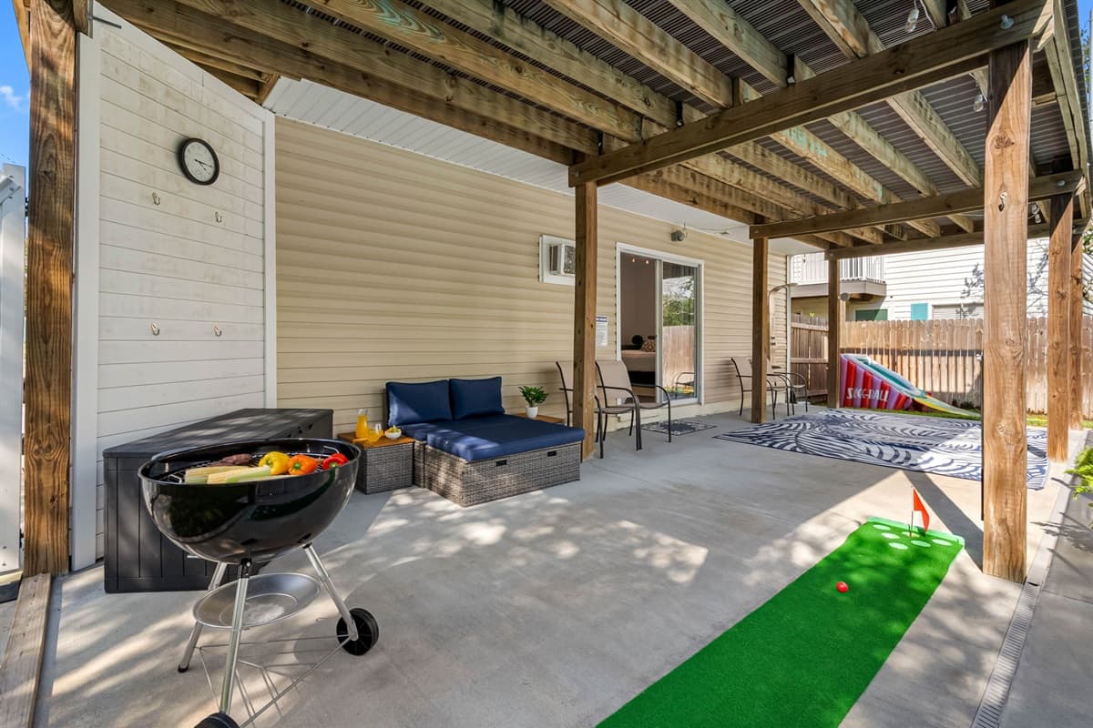 From grilling fresh meals to playing a round of mini-golf, this covered patio is designed for both relaxation and entertainment.