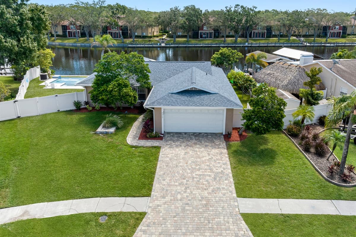 Incredible aerial front view of the house showcasing our beautiful front yard with trees and cute plants and our spacious driveway. If you are interested in this property, don't hesitate to send us an inquiry as soon as possible!