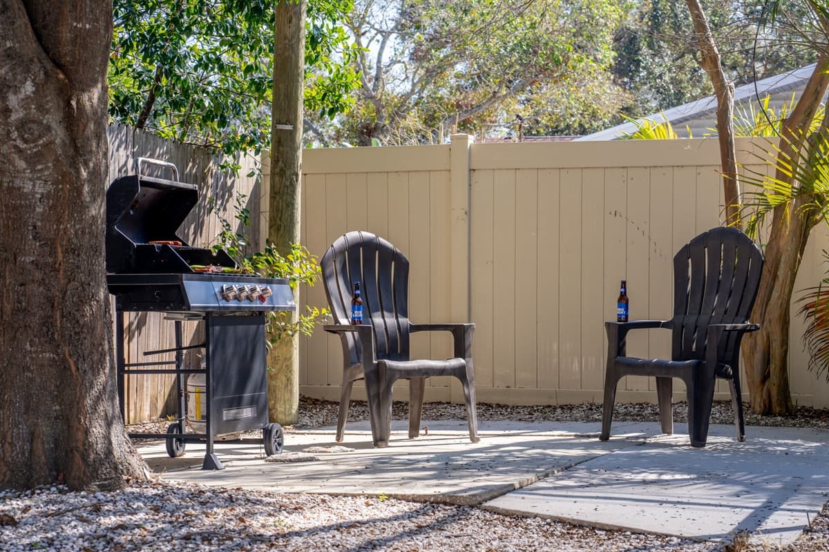 Positioned conveniently near the sparkling pool, the grill area is complemented by ample seating, ensuring that everyone can relax and socialize while the food is being prepared.