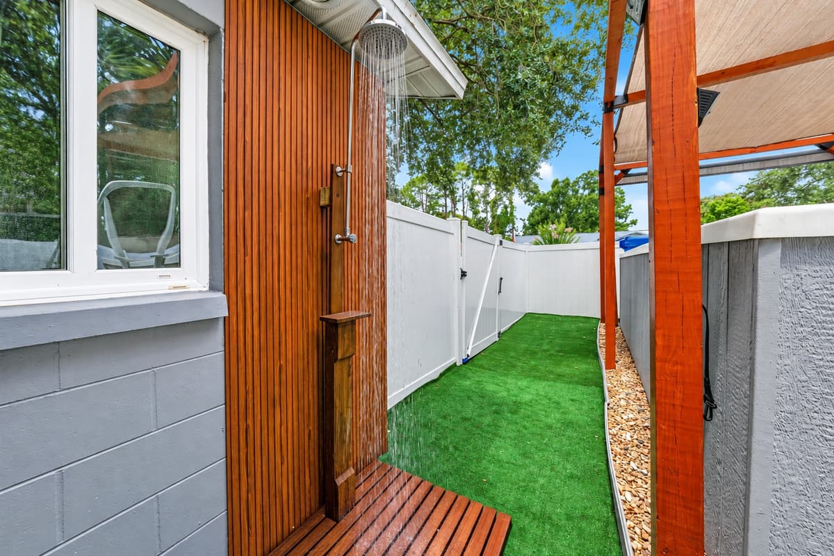 Freshen up with the private outdoor shower, thoughtfully located beside the swim spa for added convenience.
