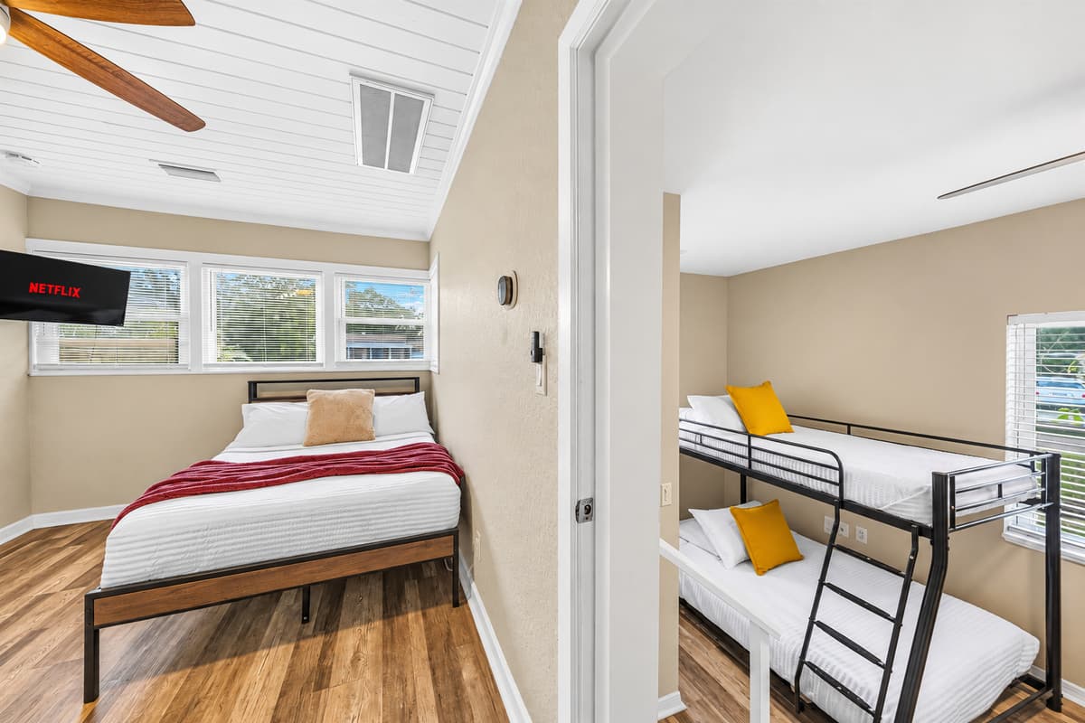 Bedrooms 3 and 4 are connected. To access Bedroom 4, you’ll need to pass through Bedroom 3. However, both bedrooms do have their own doors for privacy.