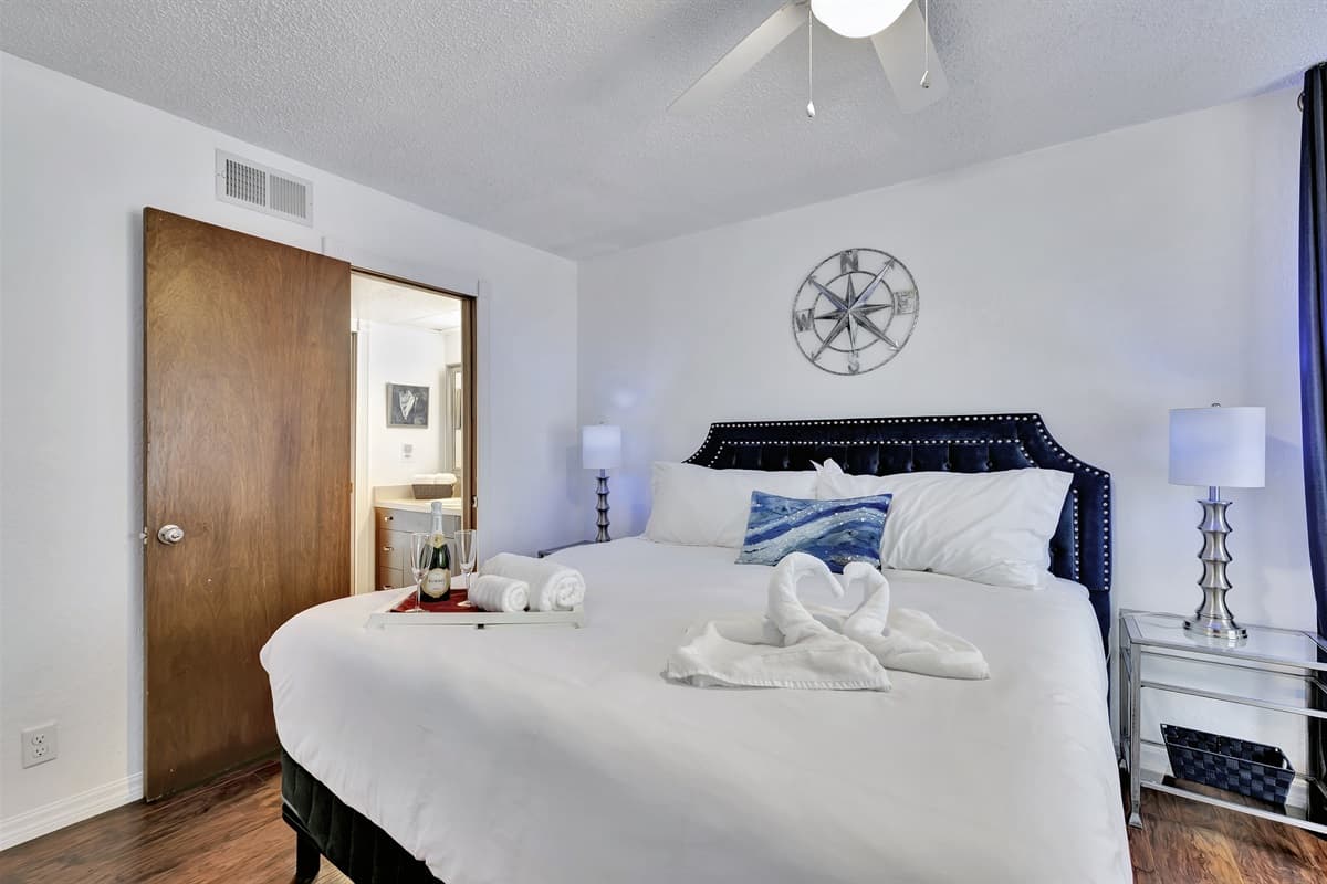 This bedroom features an ensuite bathroom, a private oasis where you can pamper yourself in style.