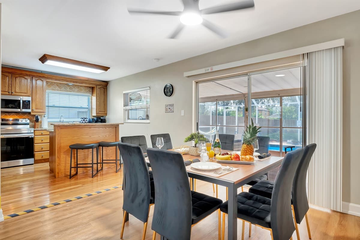 This dining area serves as the perfect hub for both delectable meals and effortless indoor-outdoor living.