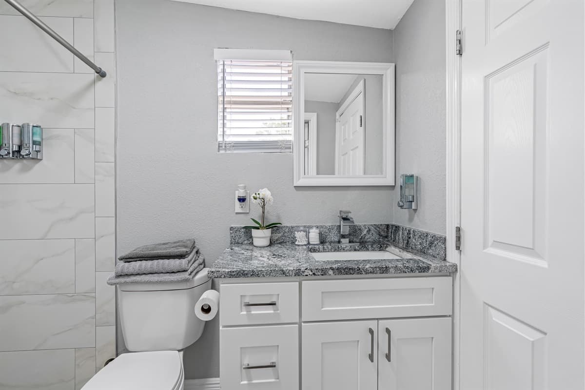 As you step inside, you'll be struck by the clean lines and elegant finishes that make this bathroom a true oasis.