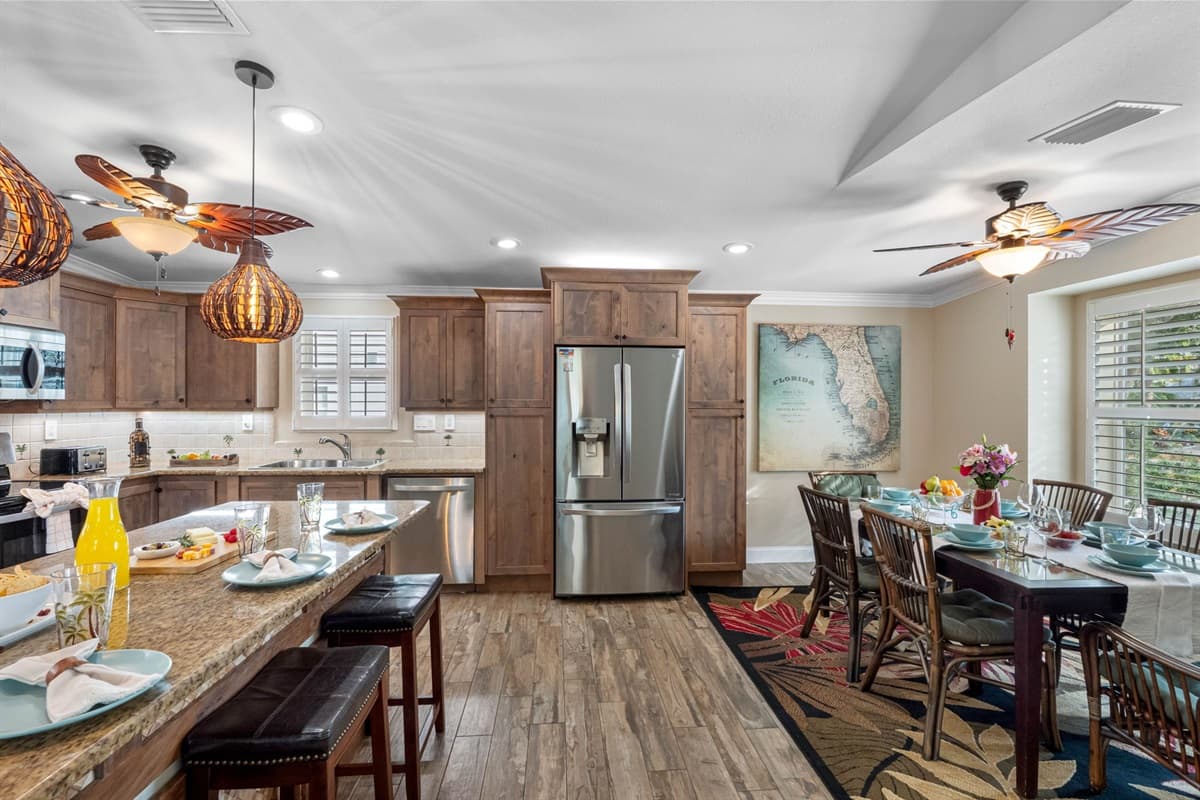 A perfect balance of rustic and modern—wood cabinetry paired with granite counters creates a warm, welcoming cooking environment.