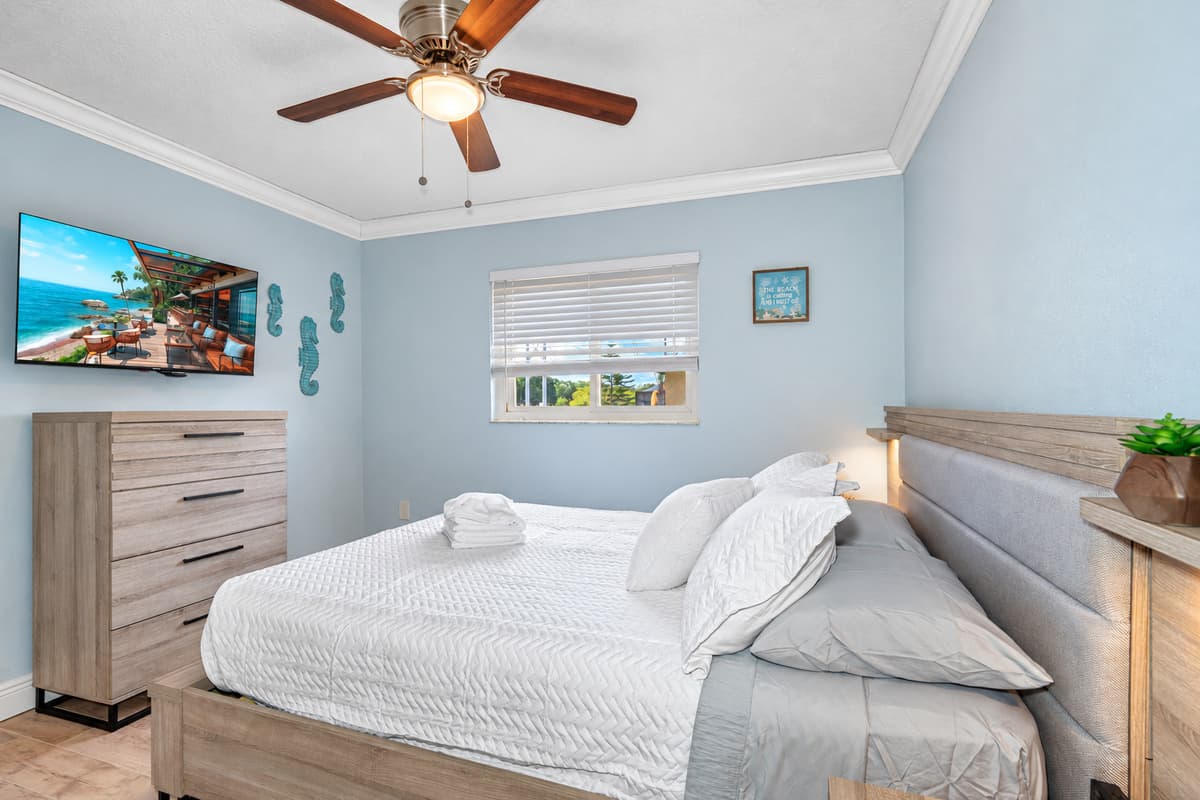 The room's thoughtful layout and stylish decor add to its charm, making it a delightful place to rest and rejuvenate.