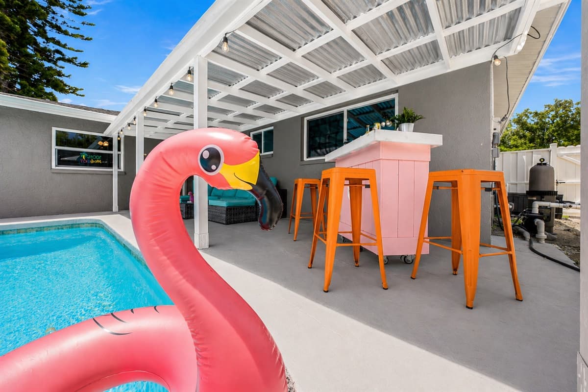 Fun poolside scene featuring colorful seating.