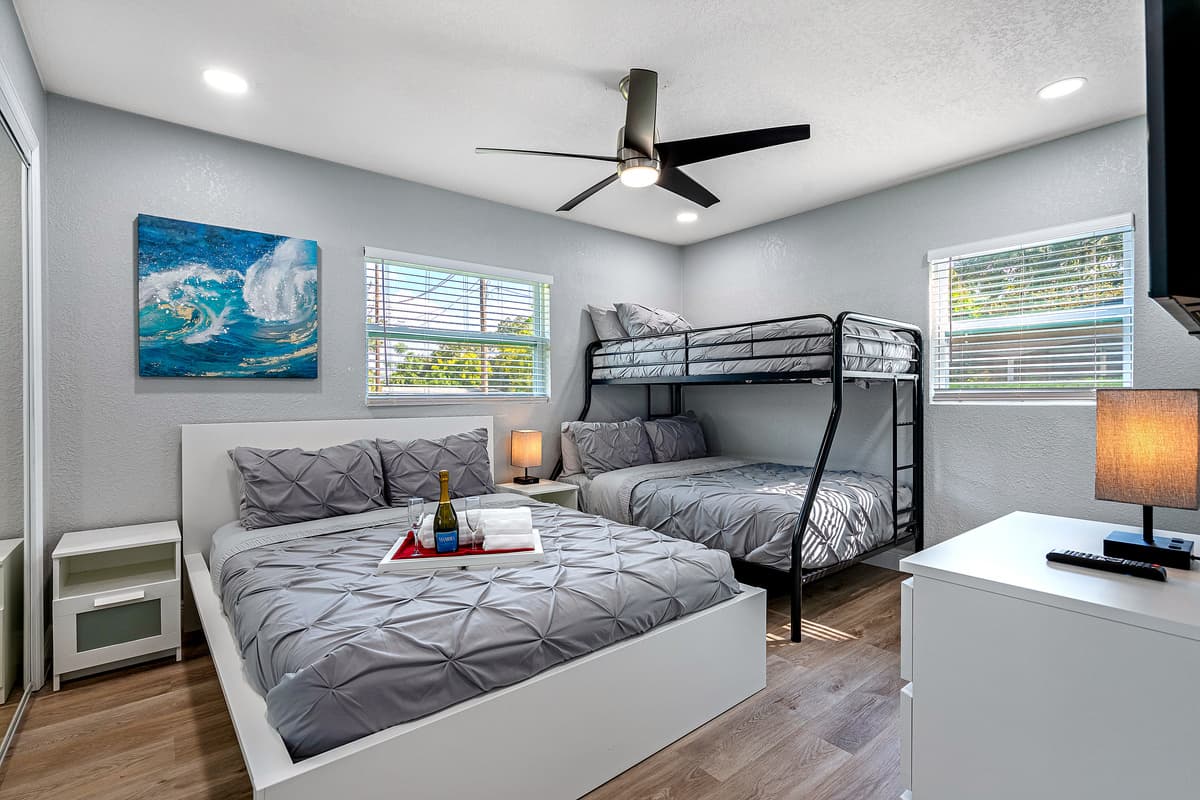 Our magnificent bedroom with a comfortable double sized bed, double over single bunkbed, full length mirror closet, and has its own smart TV. If you think you'd enjoy your trip to this property, send us a message now!