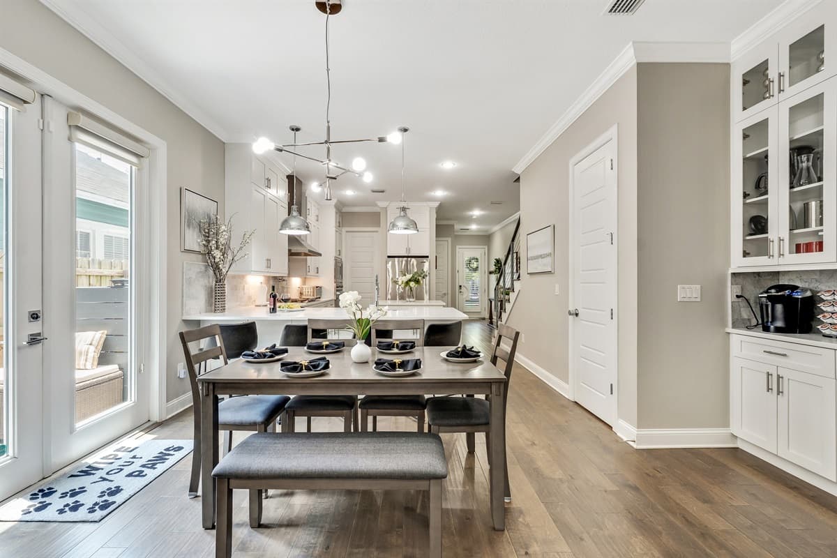 The table’s rich wood grain adds a touch of rustic charm, perfectly complementing the modern aesthetic of the surrounding décor.