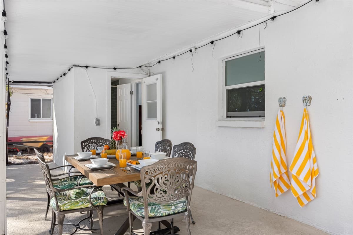 Featuring a sturdy outdoor dining table with ample seating, allowing everyone to dine together in style.