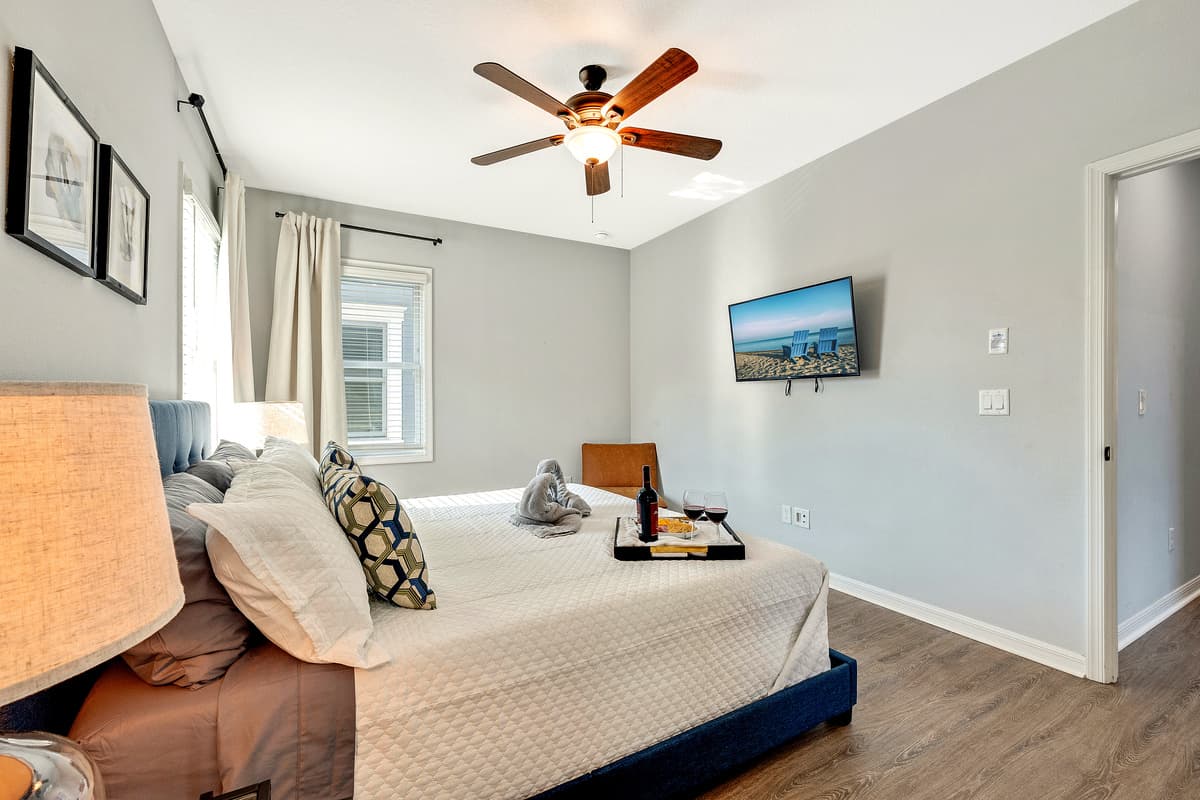 Natural light cascades through expansive windows, accentuating the tasteful decor and creating an inviting ambiance.