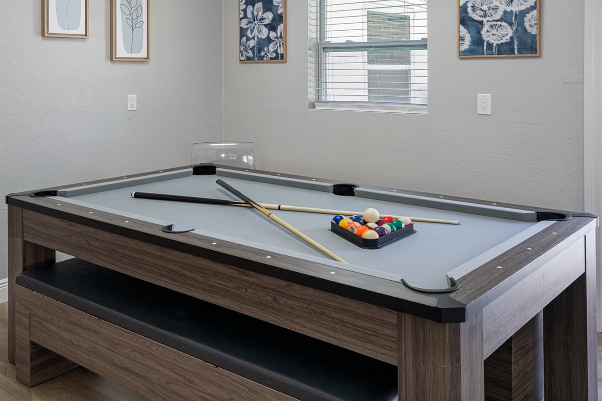 The dining table can also be converted into a pool table and ping pong table!