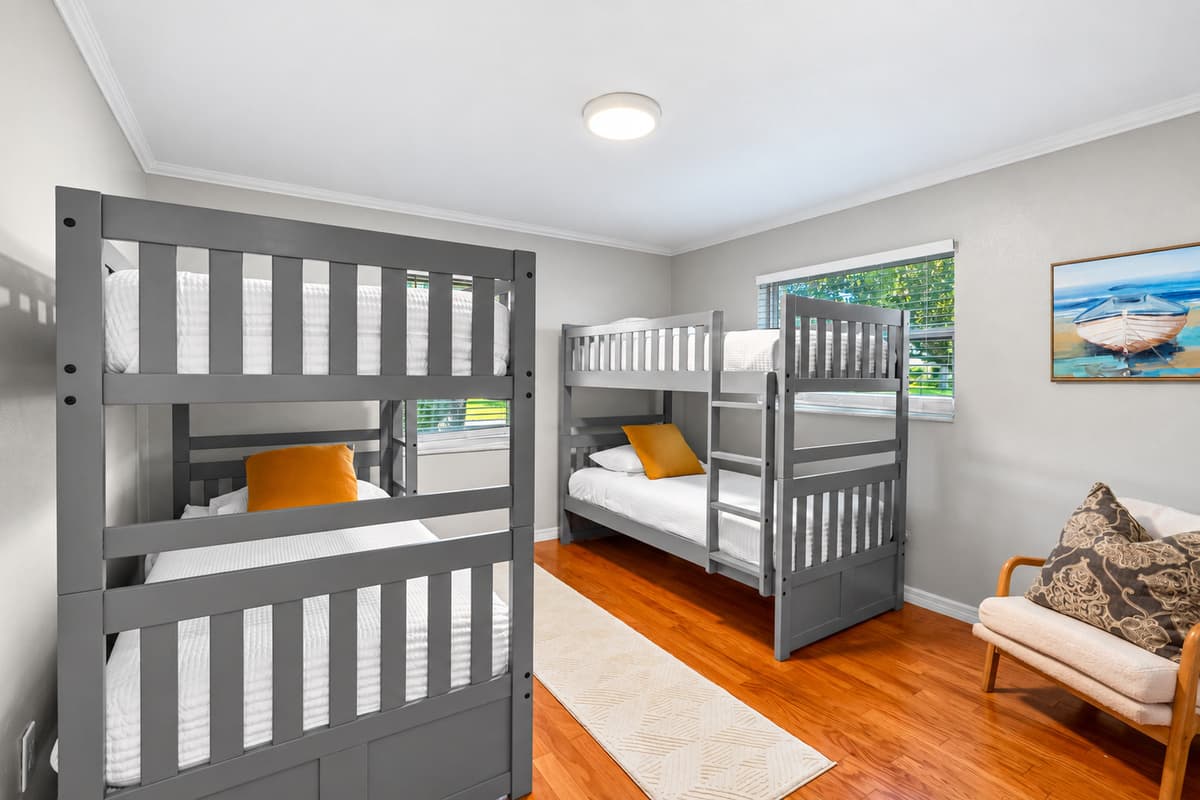 Designed with families in mind, this playful room offers cozy sleeping arrangements for up to four guests.
