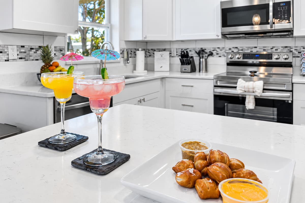 Bright, modern kitchen with quartz countertops—perfect for preparing meals and entertaining.