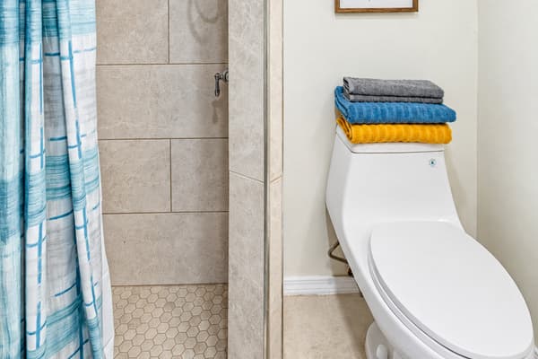 This bathroom features a modern toilet that emphasizes comfort and cleanliness.