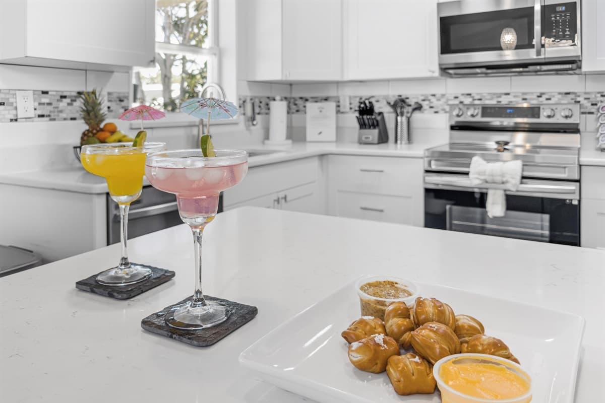 Bright, modern kitchen with quartz countertops—perfect for preparing meals and entertaining.