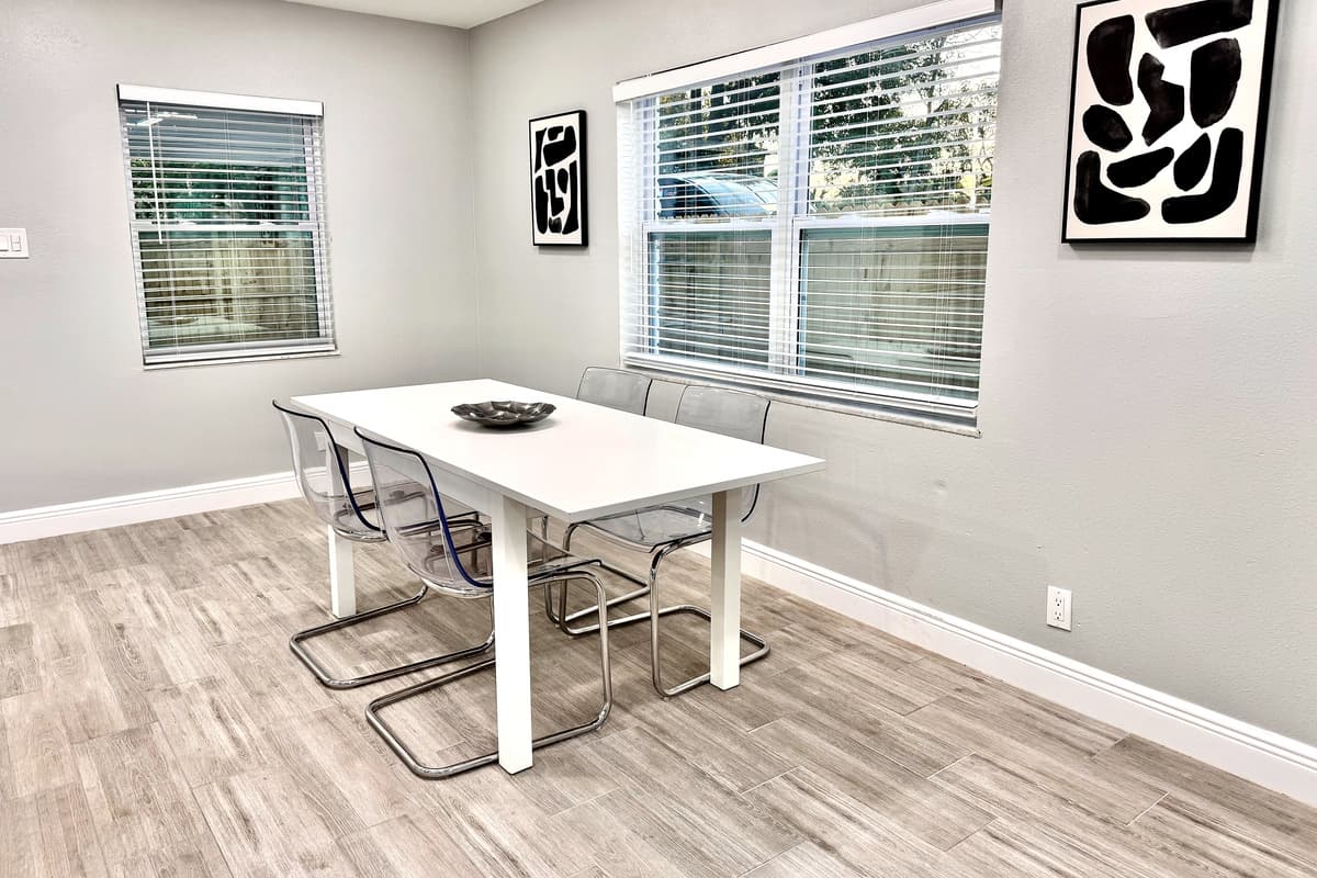 Adjacent to the kitchen is the dining area, a cozy yet stylish space designed to bring everyone together over meals.