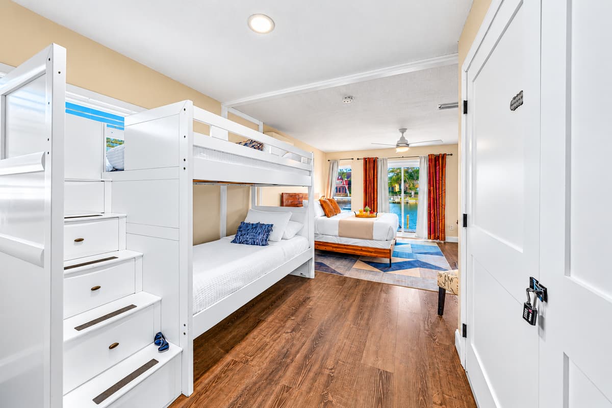 Large family suite with a king bed, bunk beds, and plenty of space for everyone.