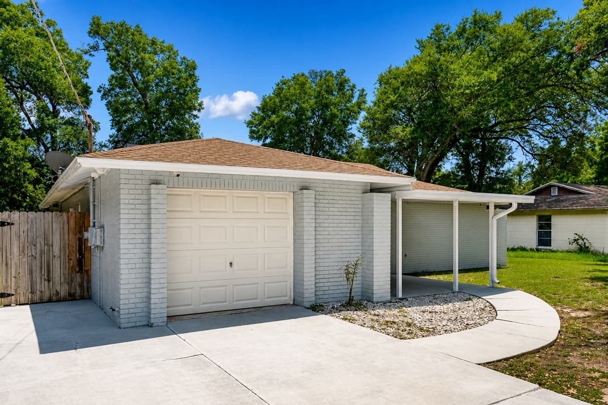 The beautiful front of the house showcasing our magnificent front yard, amazing trees, and driveway. If you are interested in this property, don't hesitate to send us a message! Book now!
