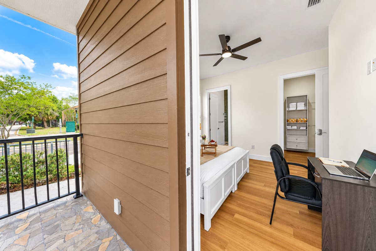 Private balcony access with outdoor view—perfect for fresh air and morning coffee.